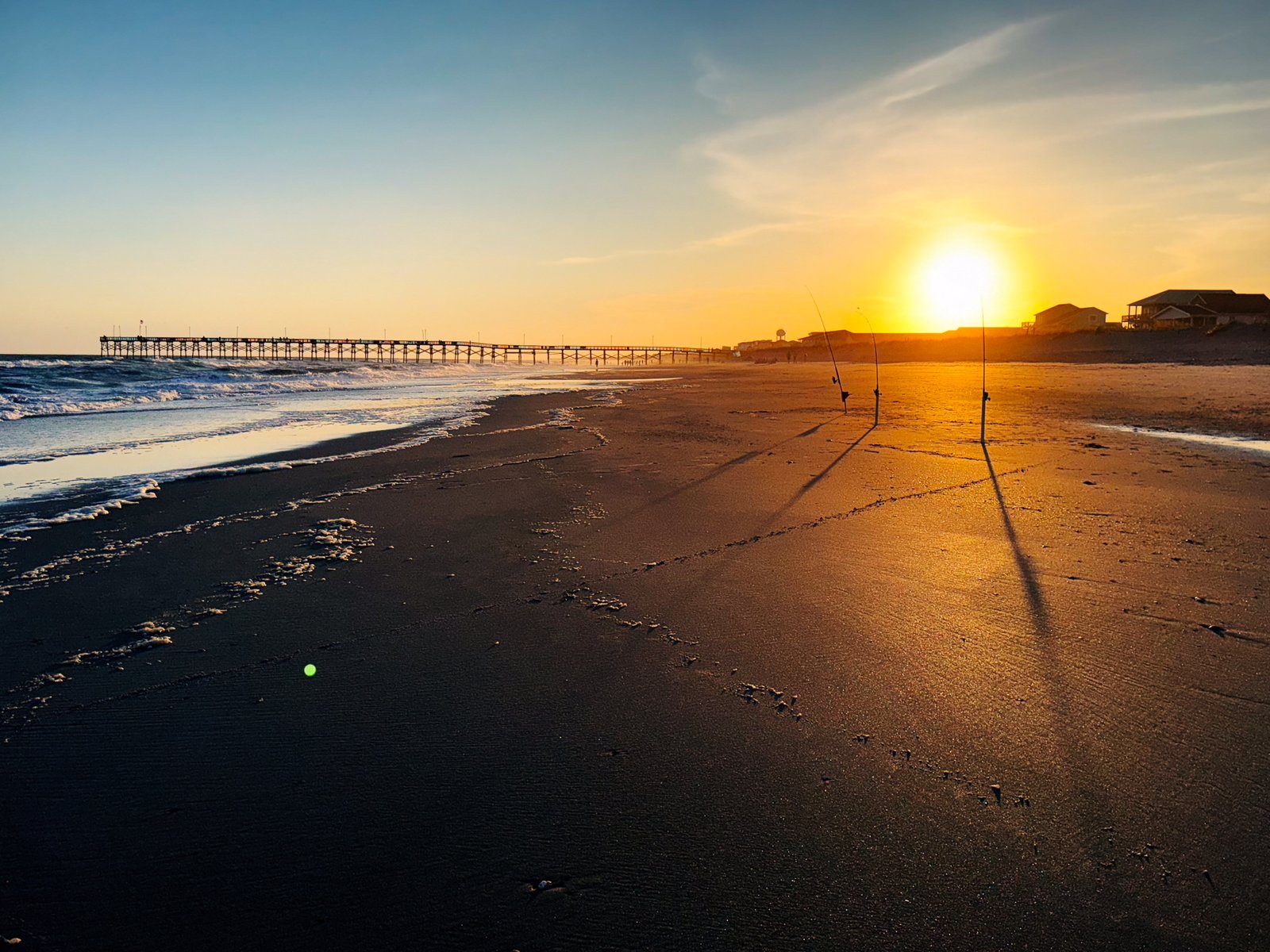 The beach was empty except for a few fishing rods.